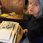 Shani Rhys James with the sketchbook
